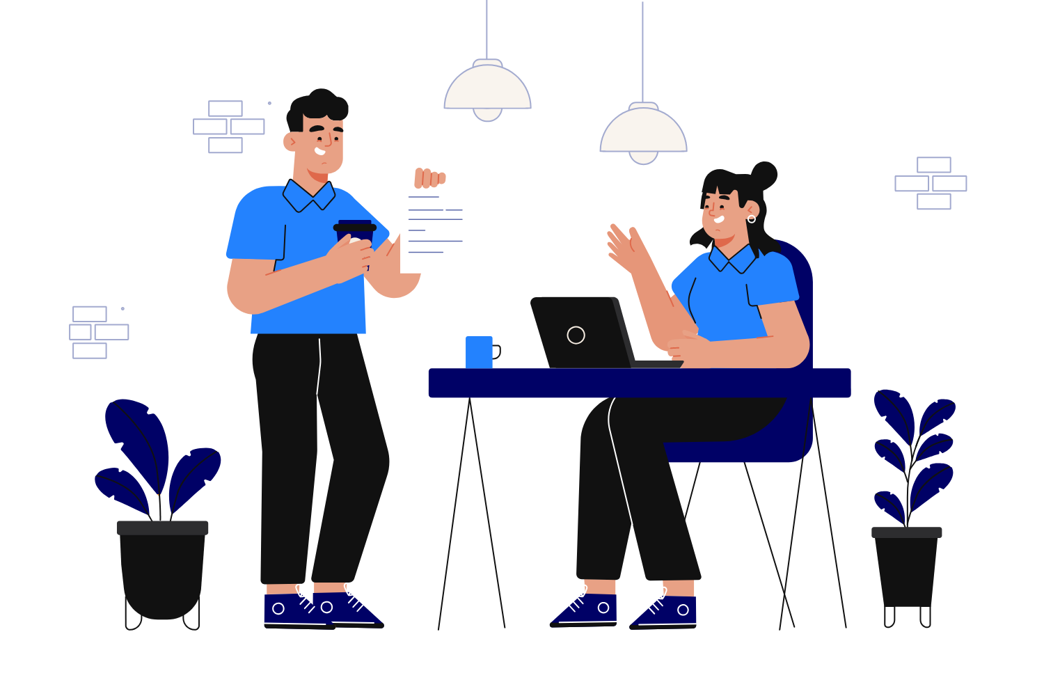 A man and woman sitting at a table with a laptop and a paper.
